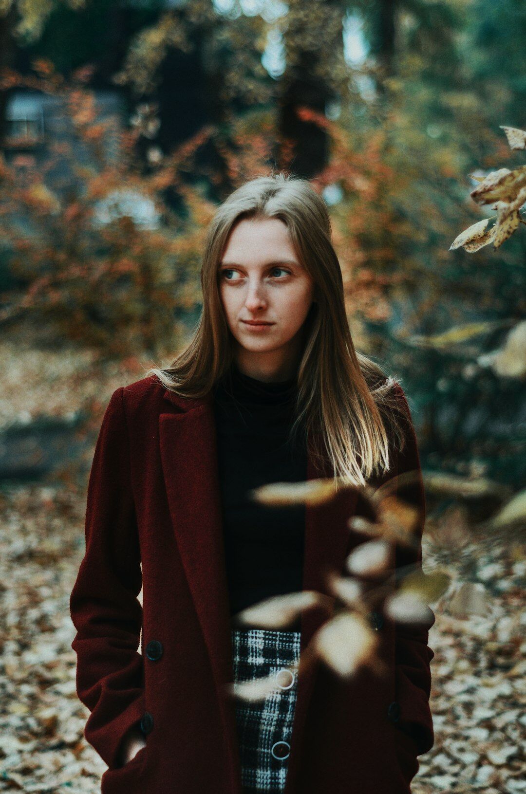 Detail of a tailored burgundy coat and elegant clothing texture
