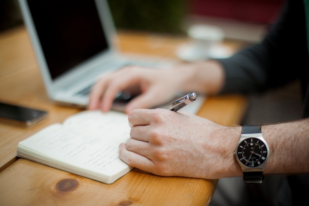 journalist writing in notebook
